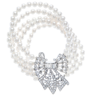 Bow + Multi Strand Pearl Bracelet on a white background
